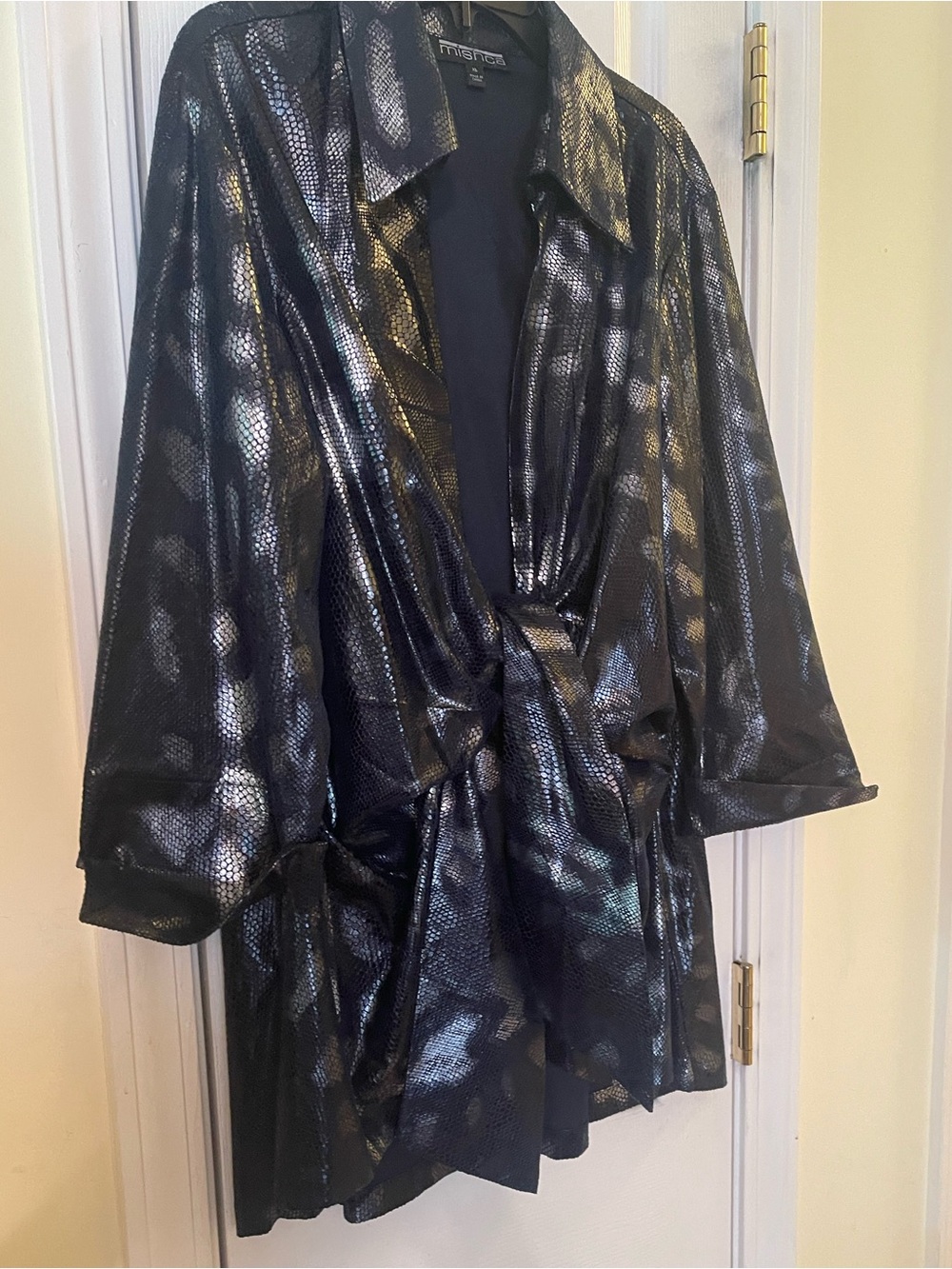 Ladies jacket with patches of snake print in the shiny material